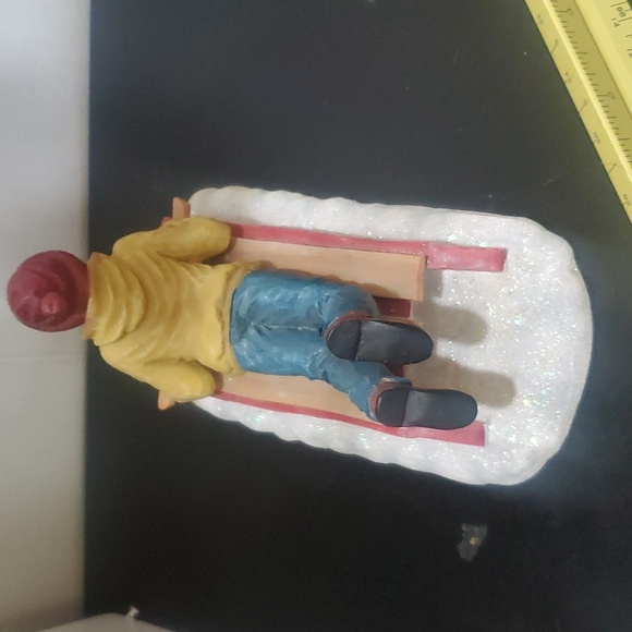 Boy in Blue & Yellow Lying Down on a Sled Holiday Lead Figure - Picture 4 of 6